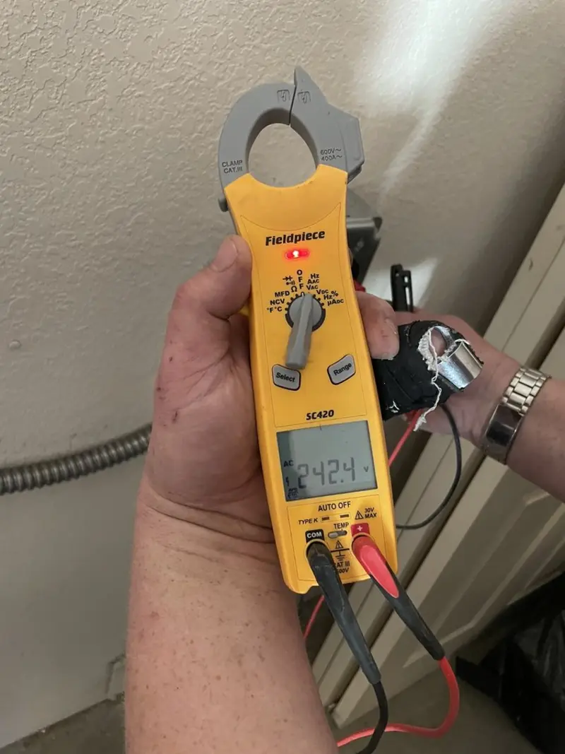 Voltage testing with clamp meter during Electrical Installation Services in Johnstown